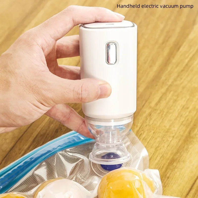 Zippered vacuum food storage bags with a handheld electric air pump, ideal for kitchen and refrigerator organization