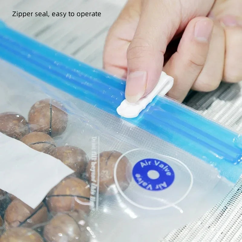 Zippered vacuum food storage bags with a handheld electric air pump, ideal for kitchen and refrigerator organization