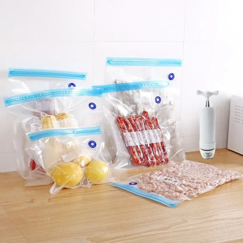 Zippered vacuum food storage bags with a handheld electric air pump, ideal for kitchen and refrigerator organization